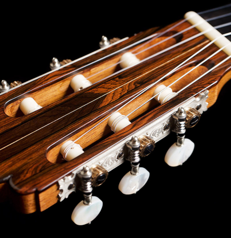 The headstock and machine heads of a 2021 Luigi Locatto classical guitar made of spruce and CSA rosewood