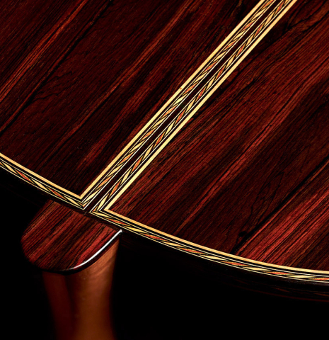 The back and sides and inlay of a 2023 Luigi Locatto classical guitar made of spruce and CSA rosewood