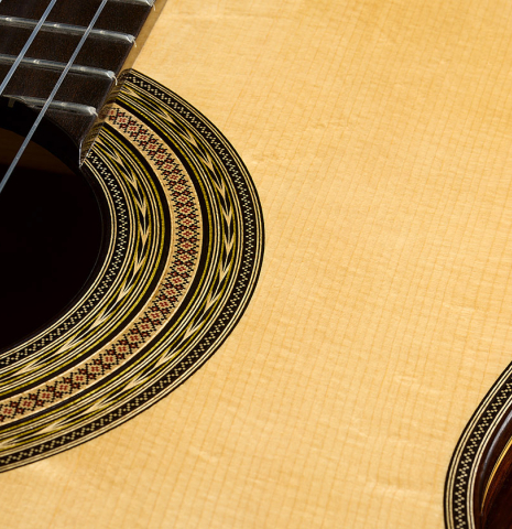 The top and rosette of a 2026 Luigi Locatto classical guitar made of spruce and CSA rosewood