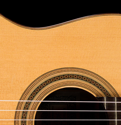The soundboard of a 2006 Luigi Locatto classical guitar made of spruce and Indian rosewood