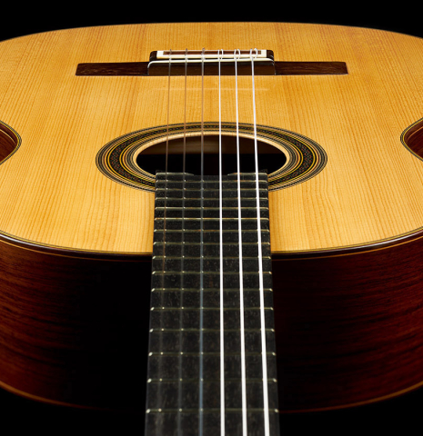 The soundboard of a 2019 Luigi Locatto classical guitar made of spruce and Indian rosewood