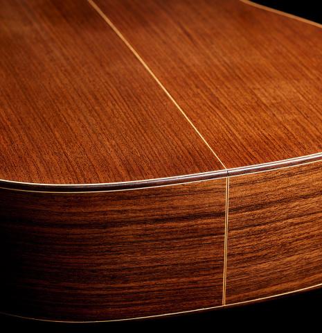 The sides at the foot and back of a 2006 Luigi Locatto classical guitar made with spruce and Indian rosewood