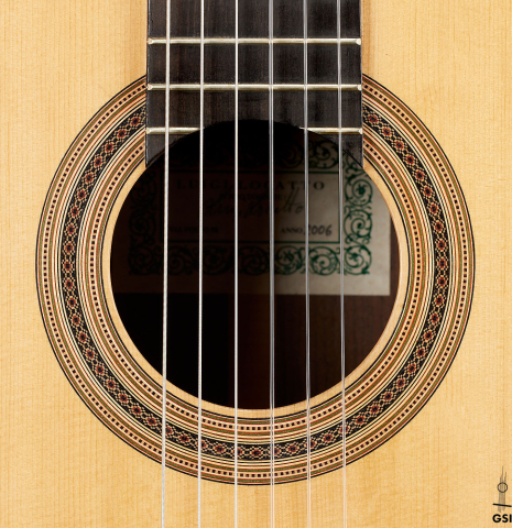 The rosette of a 2006 Luigi Locatto classical guitar made with spruce and Indian rosewood