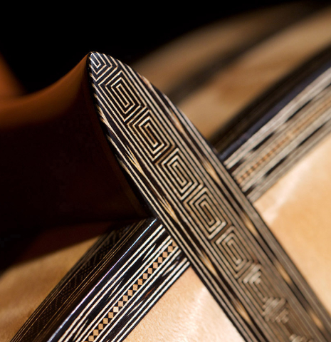 The heel of a 2021 Gabriele Lodi "Torres" classical guitar made of spruce and maple.