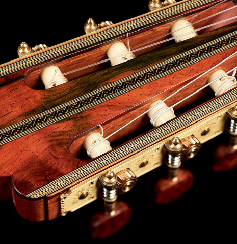 The headstock and machine heads of a 2022 Gabriele Lodi &quot;Torres&quot; classical guitar made of spruce and mahogany
