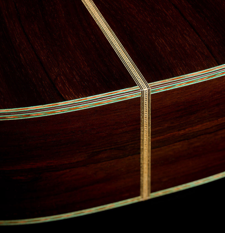 The back and sides at the foot of a 2025 Gabriele Lodi "Torres" classical guitar made of spruce and CSA rosewood