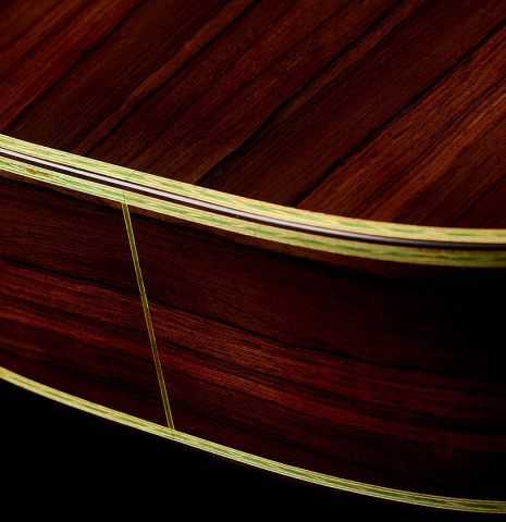 The bindings and purflings on the back and sides of a 2020 Gabriele Lodi "Torres" classical guitar made of spruce and CSA rosewood
