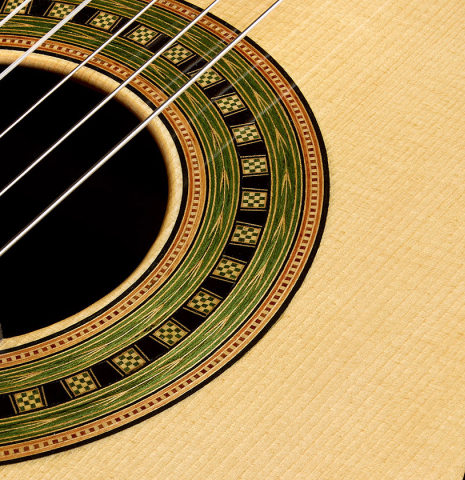 The soundboard and rosette detail of a 2020 Gabriele Lodi "Torres" classical guitar made of spruce and CSA rosewood