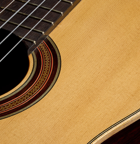 The top and rosette of a 2019 Gabriele Lodi "Esteso" classical guitar made of spruce and Indian rosewood