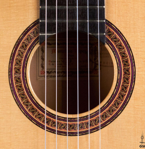 The rosette of a 1965 Marcelino Lopez classical guitar made of spruce and cypress