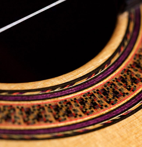 A close-up of the rosette of a 1965 Marcelino Lopez classical guitar made of spruce and cypress