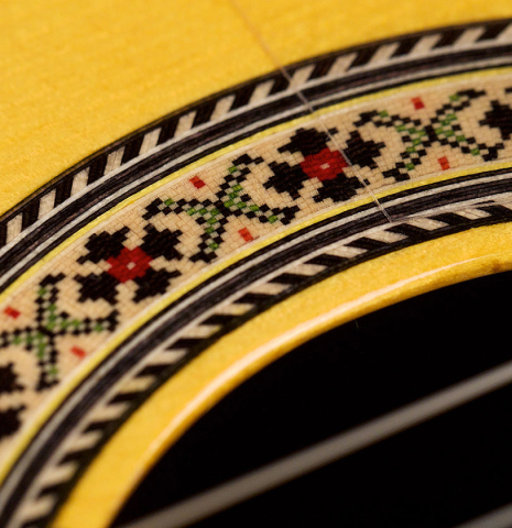 A close-up of the rosette of a 2021 Hermanos Sanchis Lopez &quot;Antonio Rey&quot; flamenco guitar made of spruce and Indian rosewood