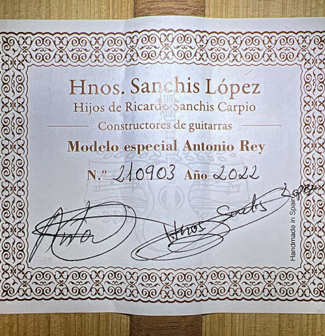 The label of a 2022 Hermanos Sanchis Lopez &quot;Antonio Rey&quot; flamenco guitar made with spruce and cypress