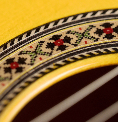 A close-up of the rosette of a 2022 Hermanos Sanchis Lopez "Antonio Rey" flamenco guitar made with spruce and cypress