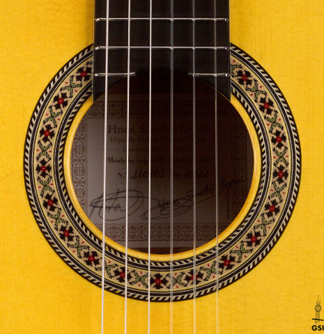 The rosette of a 2022 Hermanos Sanchis Lopez "Antonio Rey" flamenco guitar made with spruce and cypress