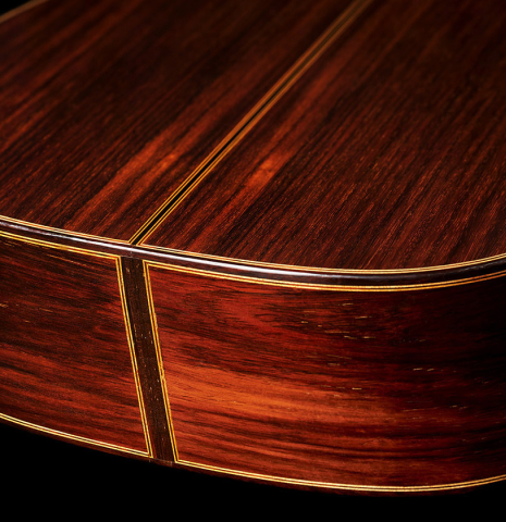 The back and sides at the foot of a 2012 Marcelino Lopez "1851 Jose Pernas" classical guitar made of spruce and Indian rosewood