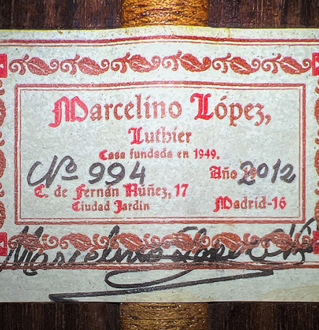 The label of a 2012 Marcelino Lopez "1851 Jose Pernas" classical guitar made of spruce and Indian rosewood