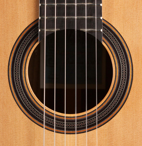 The rosette of a Loriente &quot;Clarita&quot; classical guitar made of cedar and Indian rosewood