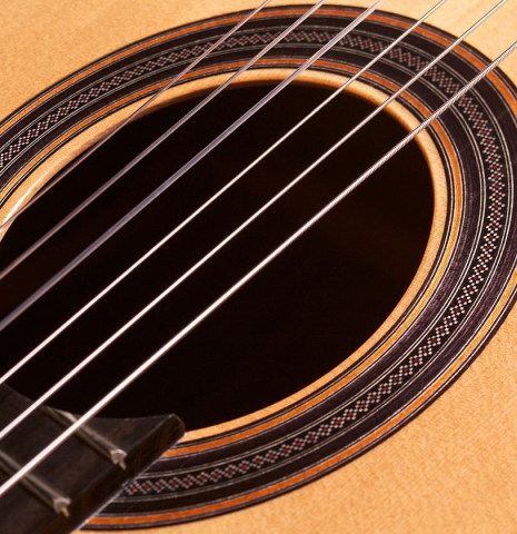 The rosette of a Loriente &quot;Clarita&quot; classical guitar made of cedar and Indian rosewood