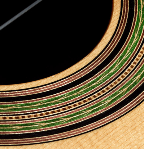 Closeup detail of the rosette of a Loriente "Isabel" classical guitar made pf spruce and pau ferro