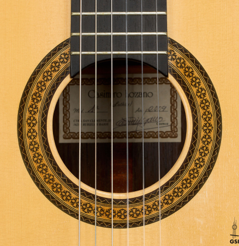 The rosette of a 2009 Casimiro Lozano classical guitar made of spruce and African rosewood