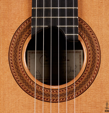 The rosette of a 2013 Andres Marvi classical guitar made of cedar and CSA rosewood