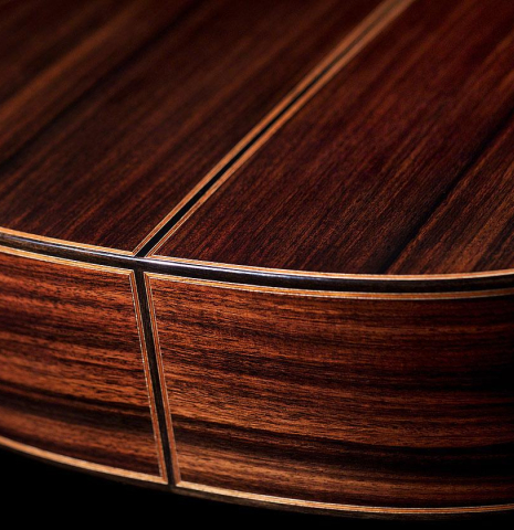 The back and sides at the foot of a 2020 Daniele Marrabello "A Nina" classical guitar made of spruce and Indian rosewood