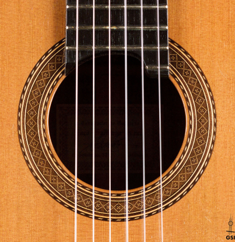 The rosette of a 1994 Paco Santiago Marin classical guitar made of cedar and Indian rosewood