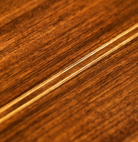 The back center seam of a 1994 Paco Santiago Marin classical guitar made of cedar and Indian rosewood
