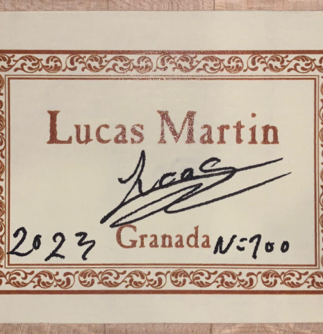 The label of a 2023 Lucas Martin #100 classical guitar made with spruce top and maple back and sides.