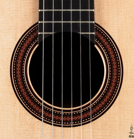 The rosette of a 2023 Lucas Martin #100 classical guitar made with spruce top and maple back and sides.