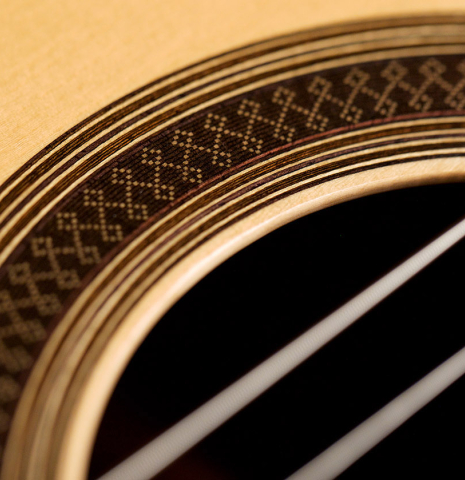Close-up detail of the rosette of a 2005 Antonio Marin Montero classical guitar made of spruce and CSA rosewood