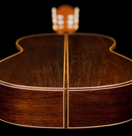 The back and sides at the foot of a 2005 Antonio Marin Montero classical guitar made of spruce and CSA rosewood