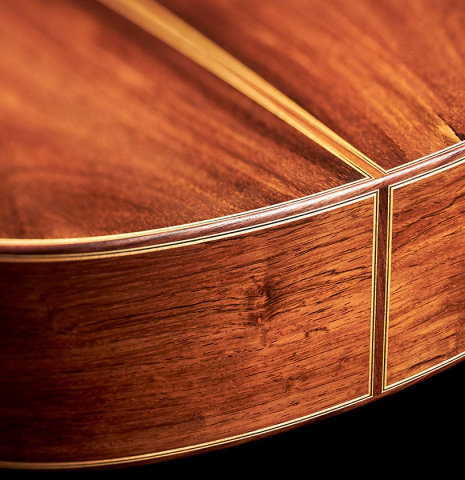 The lower bout of a 1998 Antonio Marin Montero Spanish classical guitar made with spruce and CSA rosewood.