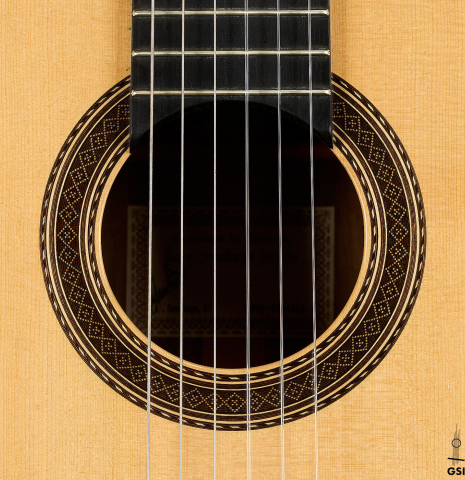 The rosette of a 2001 Paco Santiago Marin classical guitar made of spruce and CSA rosewood