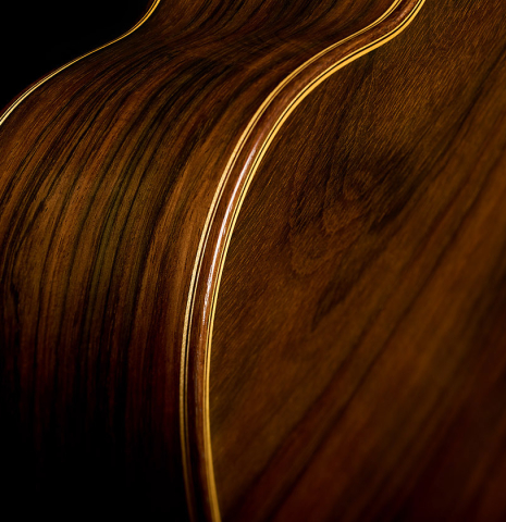 The back binding and purfling of a 2004 Antonio Marin Montero classical guitar made of spruce and CSA rosewood