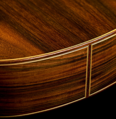 The back and sides at the foot of a 2004 Antonio Marin Montero classical guitar made of spruce and CSA rosewood