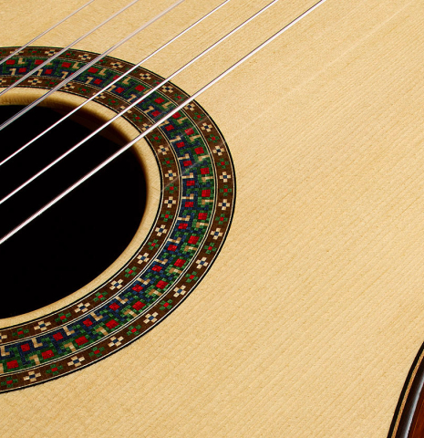 The soundboard and rosette of a 2006 Simon Marty (ex Scott Tennant) classical guitar made of spruce and cocobolo