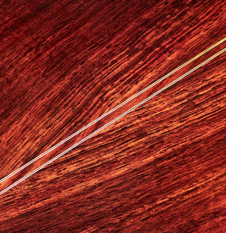 The back of a 2013 Robert Mattingly "Posthumous" classical guitar made of spruce and Indian rosewood