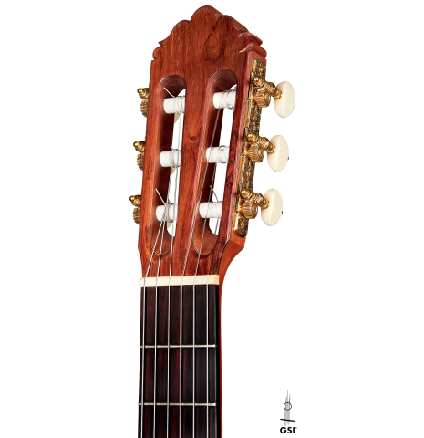 The headstock of a 2013 Robert Mattingly "Posthumous" classical guitar made of spruce and Indian rosewood
