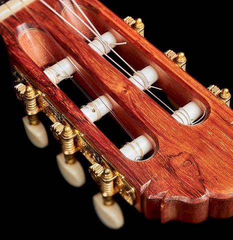 The headstock and machine heads of a 2013 Robert Mattingly "Posthumous" classical guitar made of spruce and Indian rosewood