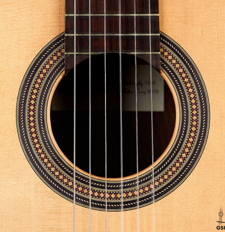 The rosette of a 2013 Robert Mattingly "Posthumous" classical guitar made of spruce and Indian rosewood
