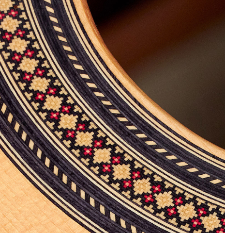 The rosette of a 2013 Robert Mattingly "Posthumous" classical guitar made of spruce and Indian rosewood