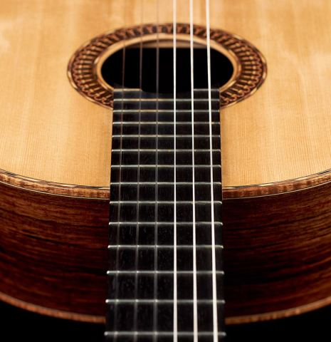 The neck of a 2021 Claudio Meneghelli  "Hommage to Jose Romanillos" classical guitar made with spruce and Indian rosewood