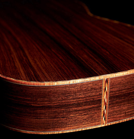 The back and lower bout of a 2021 Claudio Meneghelli  "Hommage to Jose Romanillos" classical guitar made with spruce and Indian rosewood
