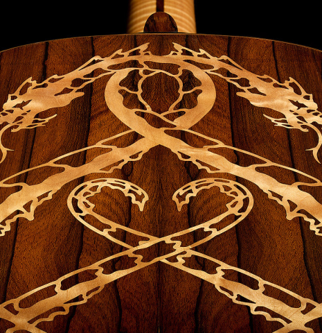 Detail of the dragon inlay in the back of a 2002 Matthew Morello classical guitar made of spruce and ziricote