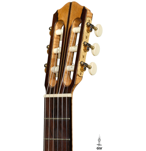 The headstock of a 2002 Matthew Morello classical guitar made of spruce and ziricote