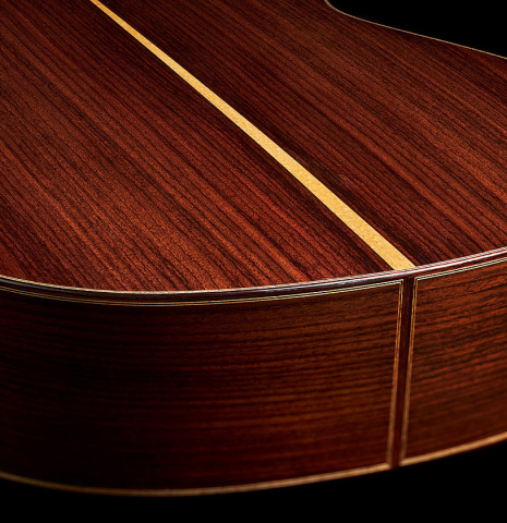 The back and sides at the foot of a 2023 Fernando Moreno classical guitar made of spruce and Indian rosewood