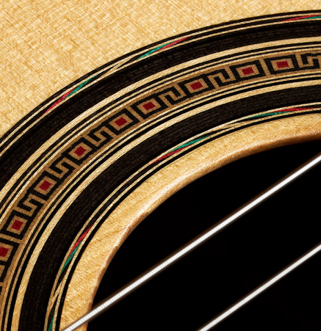 Detailed closeup of the rosette of a 2023 Fernando Moreno classical guitar made of spruce and Indian rosewood