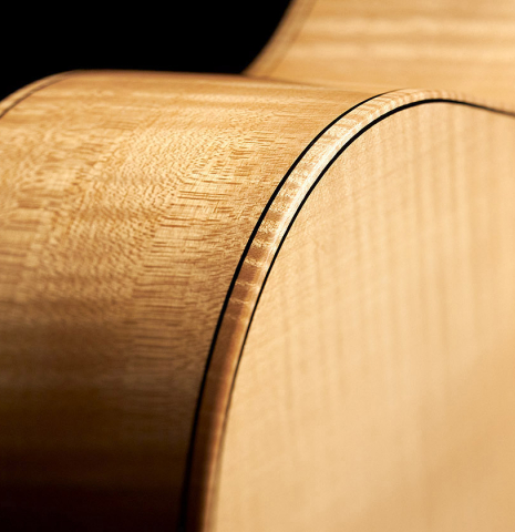 The top, sides and binding of a 2011 Rafael Moreno Rodriguez classical guitar made of spruce and maple